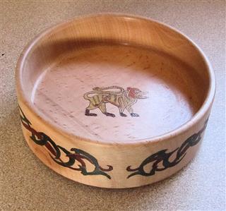 Bert Lanham turned this bowl and used pyrography to decorate it